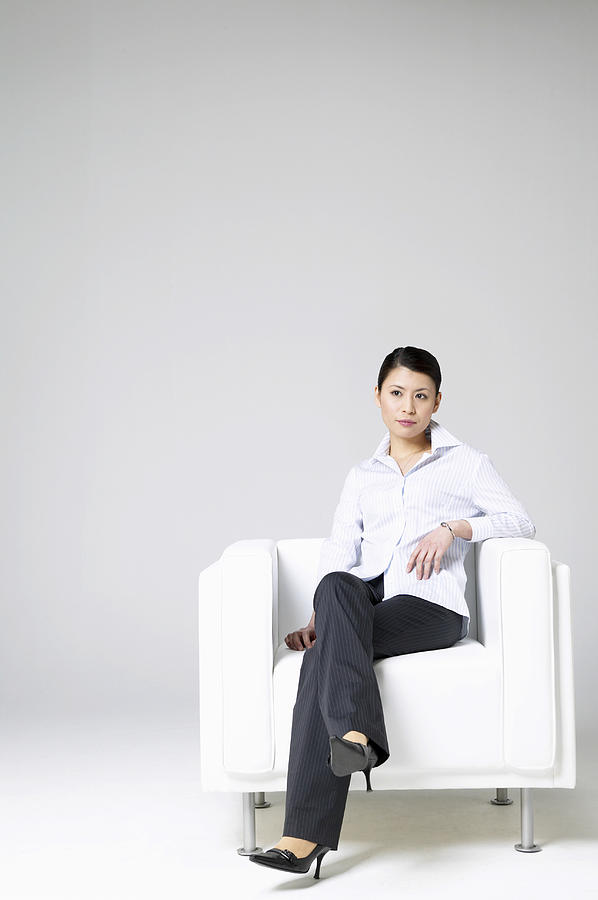 Businesswoman Sitting in an Armchair Photograph by Mash