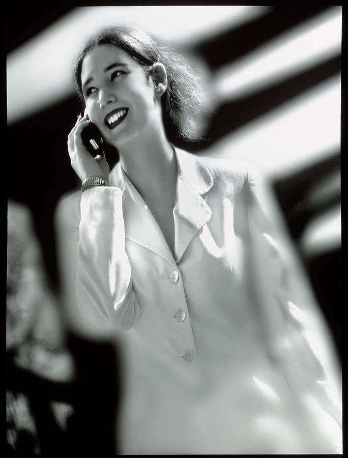 Businesswoman Speaking On A Mobile Telephone Photograph by Jesse/science Photo Library
