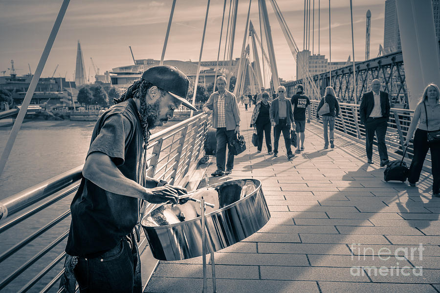Busker playing steel band drum steelpan in London Photograph by Peter Noyce