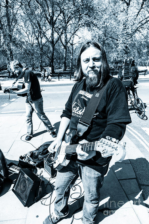 Busking musicians with electric guitars at Hyde Park Corner Lon Photograph by Peter Noyce