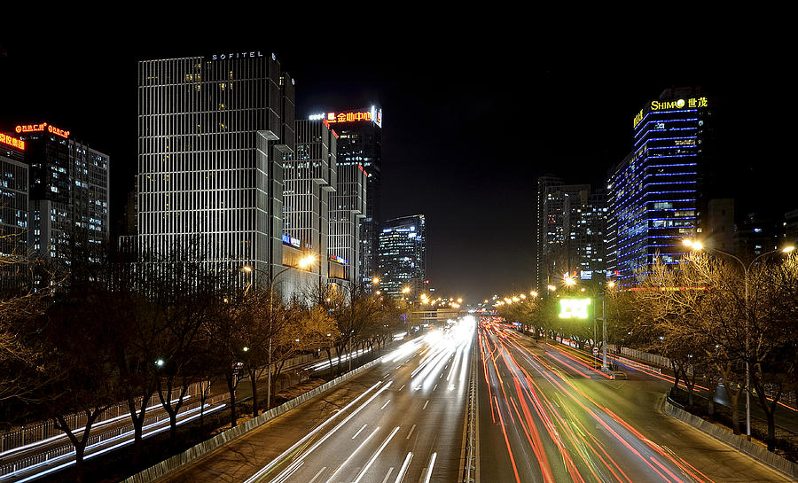 Busy Beijing - Central Business District by night Photograph by Brendan Reals