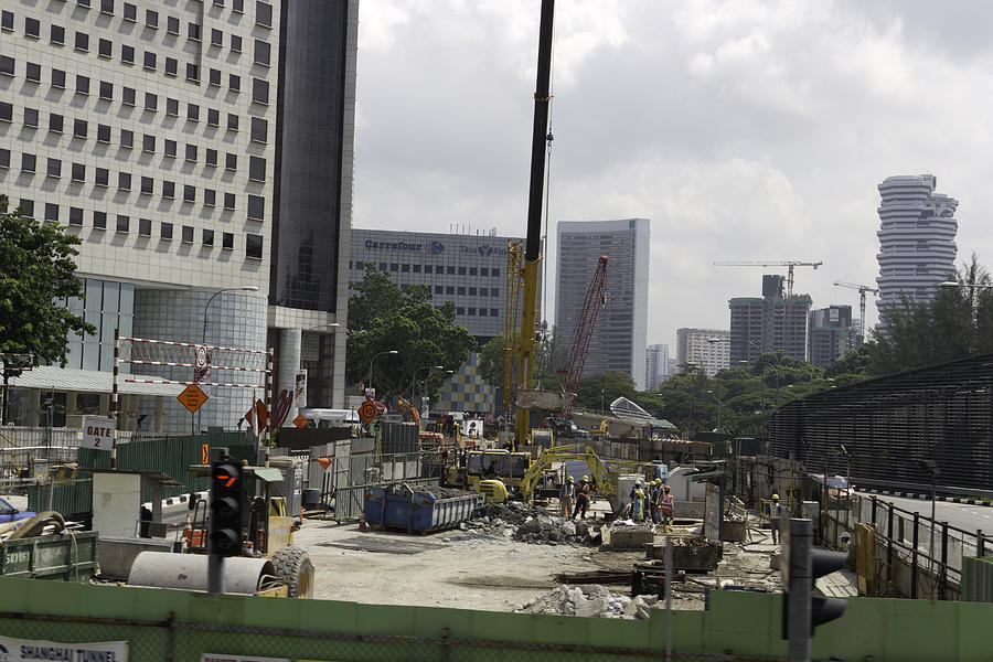 Busy construction site in Singapore with heavy machinery Photograph by Ashish Agarwal
