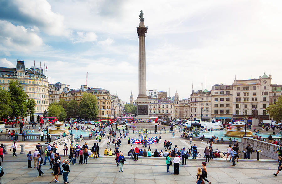 Busy Trafalgar Square London UK on sunny Autumn afternoon Photograph by NicolasMcComber