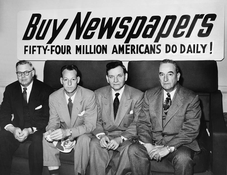 Black And White Photograph - Buy Newspapers by Underwood Archives