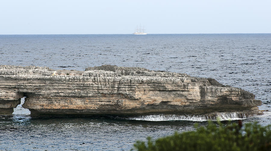 Tourist vessel leaving Minorca Island - Bye bye beloved island Photograph by Pedro Cardona Llambias