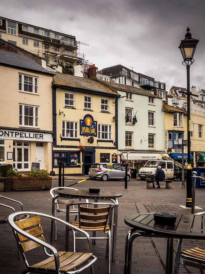 Cafe on Brixham harbour Photograph by Mark Llewellyn