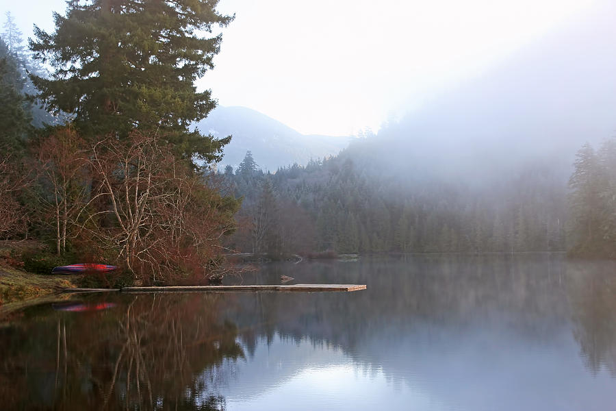 Calm Misty Lake with Canoe Photograph by Peggy Collins