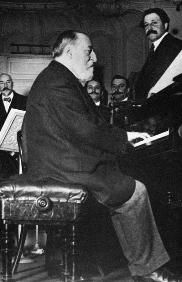 Camille Saint-Saens conducting. French composer 1835-1921