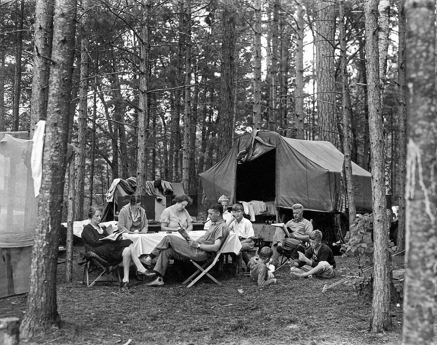 Black And White Photograph - Camping In The Woods by Underwood Archives