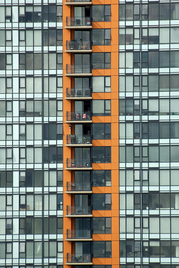 Architecture Photograph - Canada chairs. Patterned windows and balconies on a condominium  by Rob Huntley