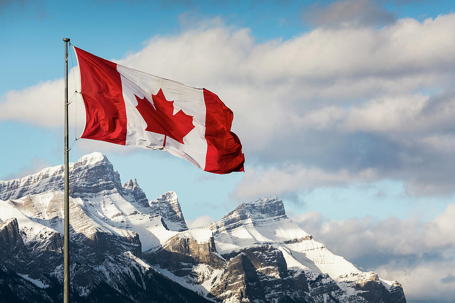 Canadian Flag Blowing In The Wind Photograph by Michael Interisano ...