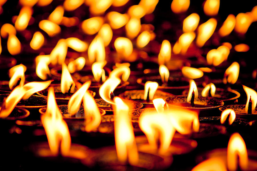 candle light in Boudnath stupa Photograph by Raimond Klavins