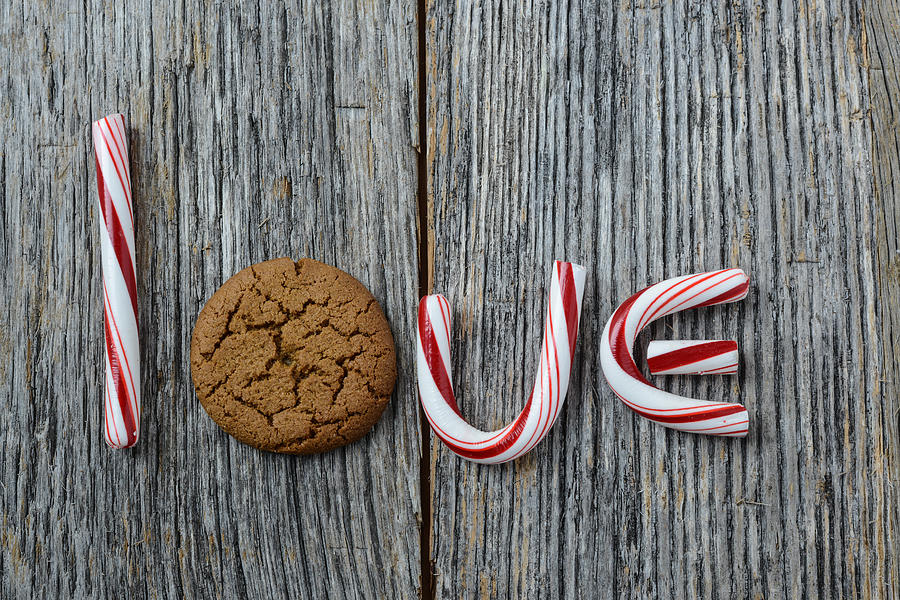 Candy Photograph - Candy Cane and Gingesnap cookie spelling the word love by Brandon Bourdages