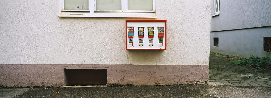 Architecture Photograph - Candy Vending Machine On The Wall by Panoramic Images
