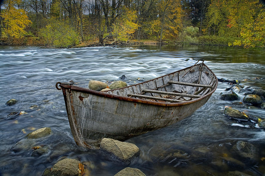 Canoe aground on the Thornapple River in Autumn Photograph by Randall Nyhof