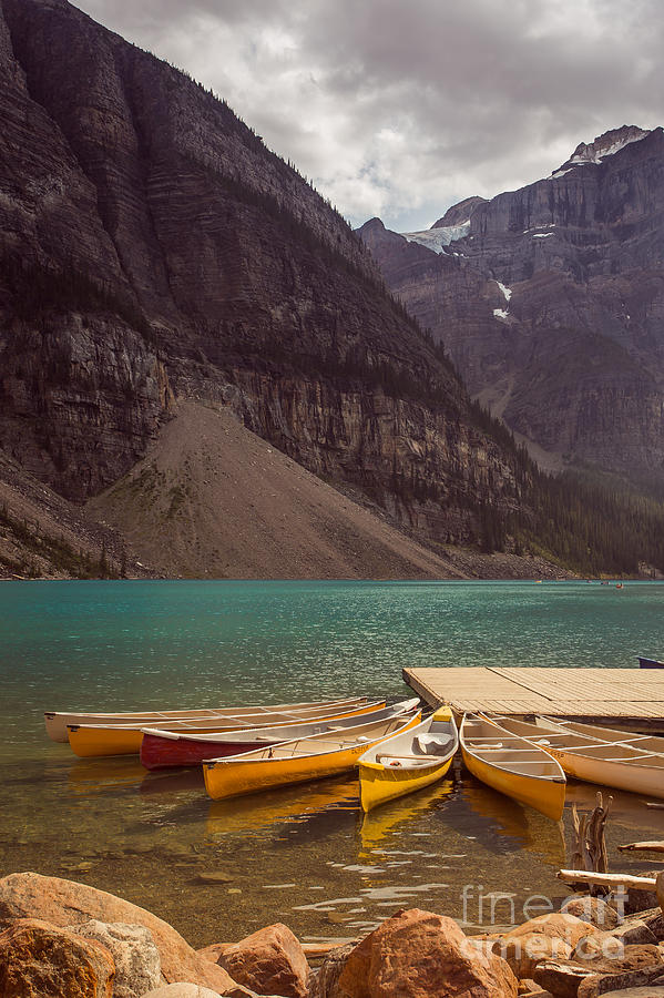 Canoe for Rent in Banffs Moraine Lake Photograph by Edward Fielding
