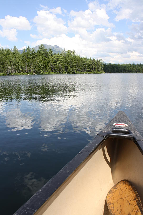 Canoeing a lake in the North woods Photograph by Toni and Rene Maggio