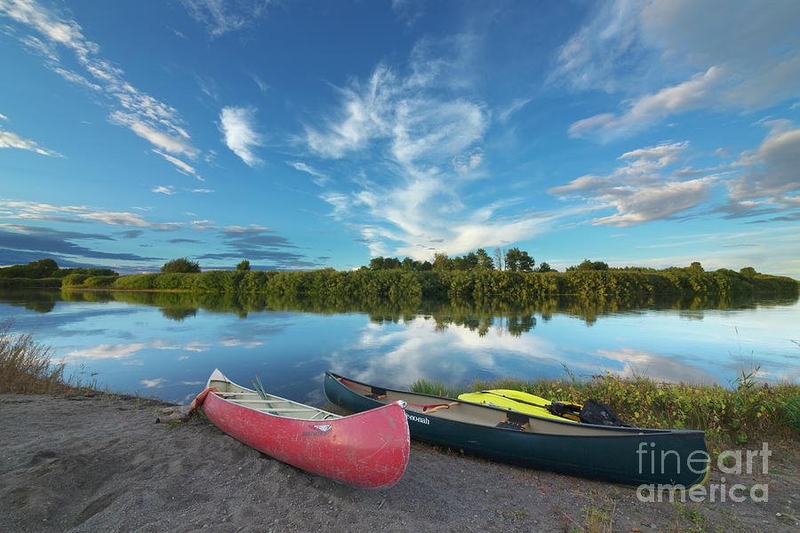 Canoes With Clouds Reflecting  Photograph by Yva Momatiuk John Eastcott