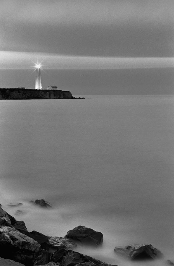 Cap aux Rosiers lighthouse Photograph by Arkady Kunysz