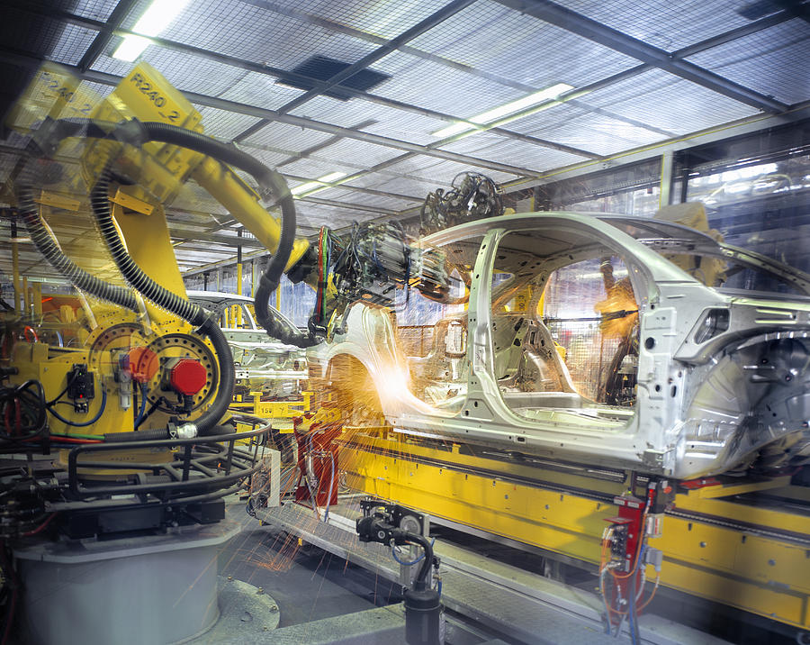 Car body welding robots in car factory Photograph by Monty Rakusen
