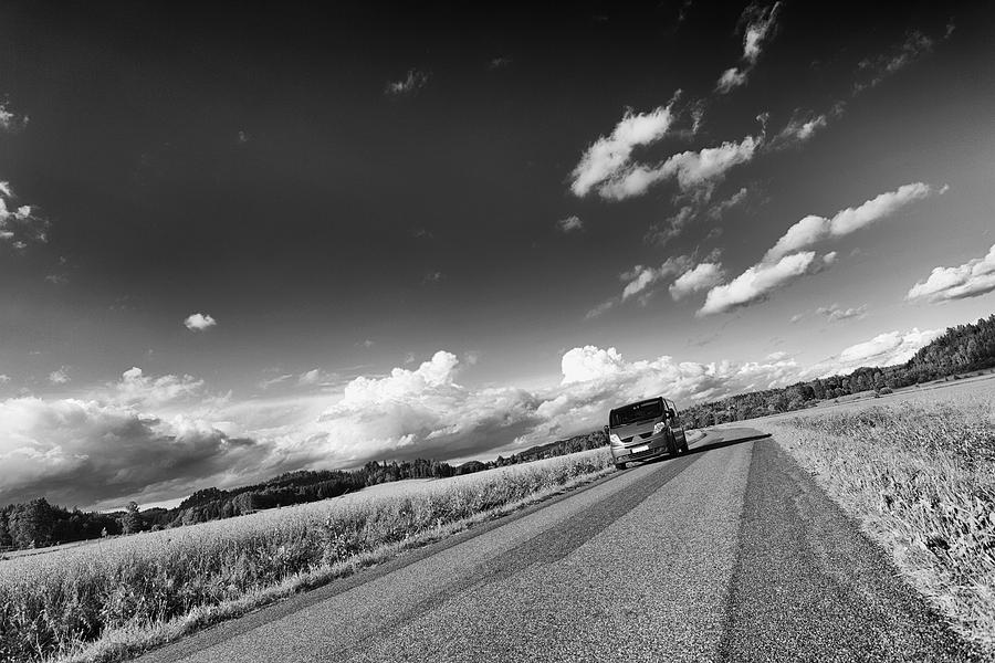 Car Drive On Lonely Country-road Photograph by Christian Lagereek