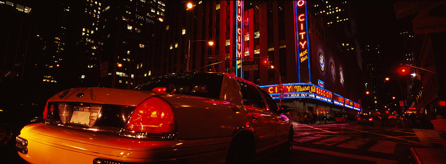 New York City Photograph - Car On A Road, Radio City Music Hall by Panoramic Images