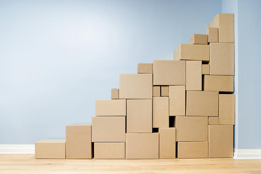 Cardboard boxes stacked one on another in shape of stairs Photograph by Jorg Greuel