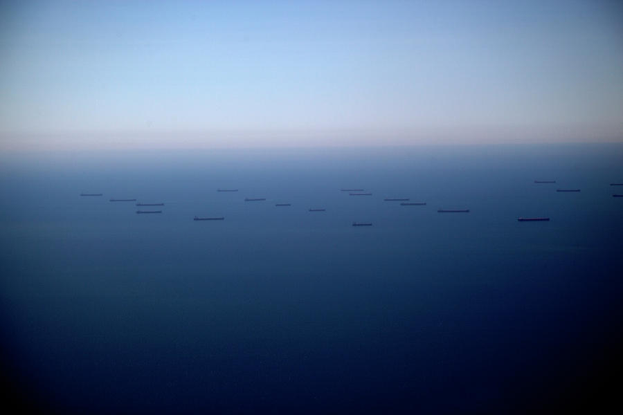 Cargo Ships Out At Sea Photograph by Tobias Titz