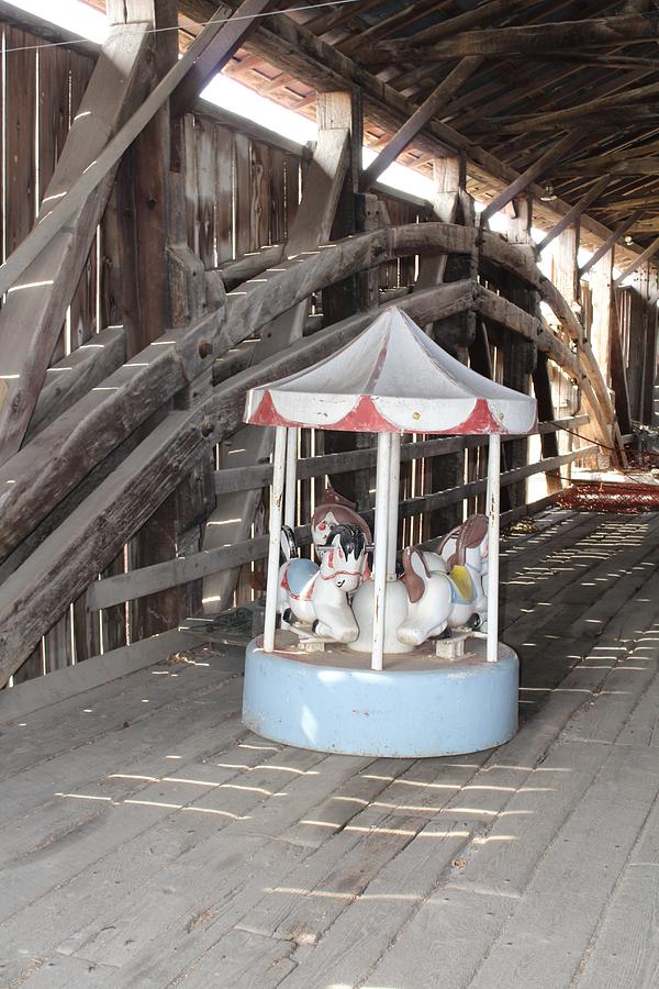Carousel in a bridge Photograph by Denise Cicchella