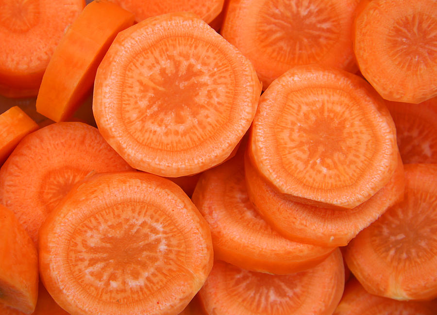 Carrot slices Photograph by Mgfoto