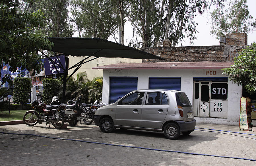 Cars and bikes in a small parking Photograph by Ashish Agarwal
