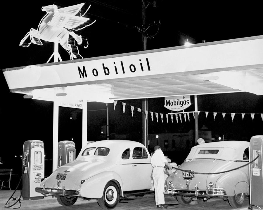 Cars At A Mobil Gas Station Photograph by Underwood Archives