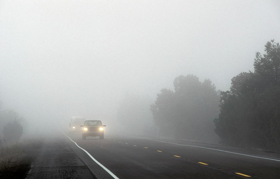 Cars Driving Through Fog Photograph by Jim Reed/science Photo Library