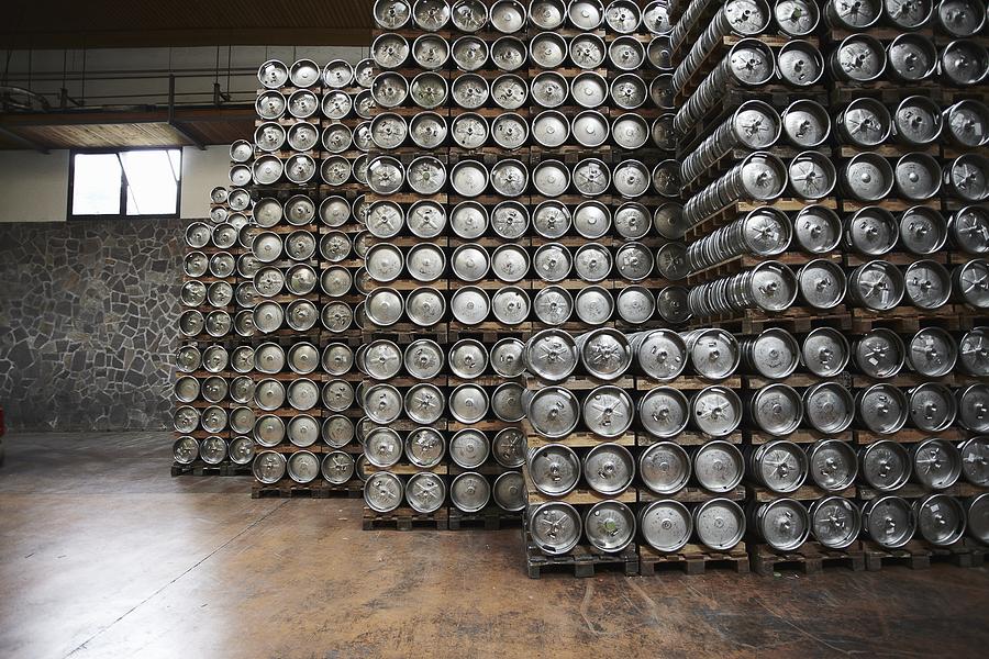 Casks of beer stacked in a brewery Photograph by Stefano Gilera