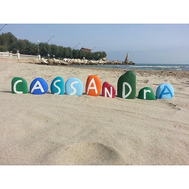 Beach Photograph - Cassandra, Female Name On Colored Stone by Adriano La Naia