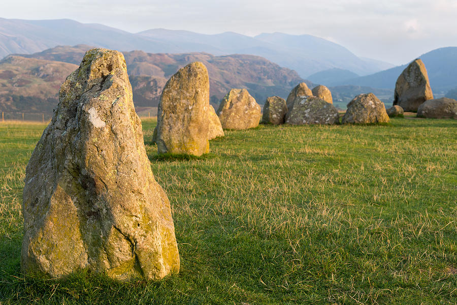 Landscape Photograph - Castlerigg Stone Circle at Sunset with Helvellyn in the Distance by Chris Blake