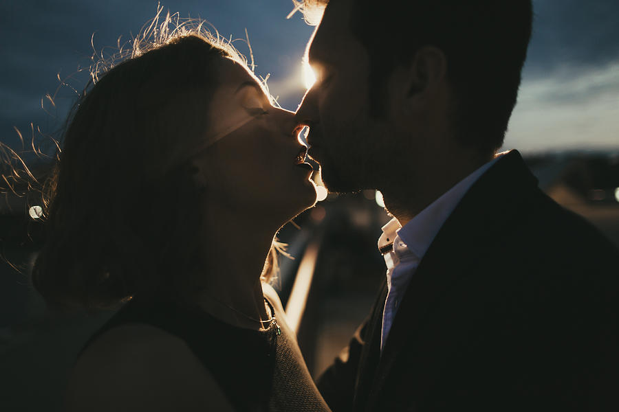 Caucasian couple kissing at night Photograph by Kateryna Soroka