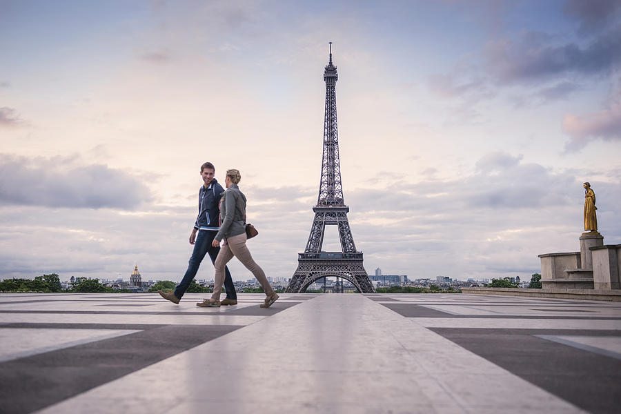 Caucasian couple walking near Eiffel Tower, Paris, France Photograph by Jacobs Stock Photography Ltd