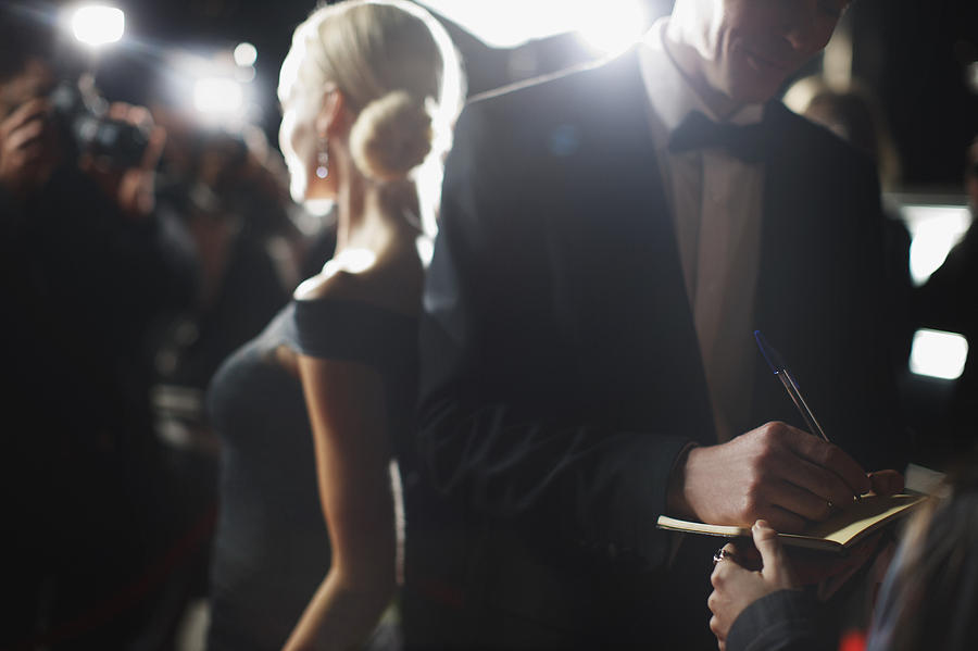 Celebrity signing autographs on red carpet Photograph by Paul Bradbury