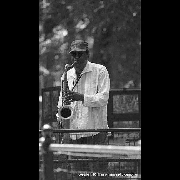 Black And White Photograph - Central Park Sax by Aaron Kremer
