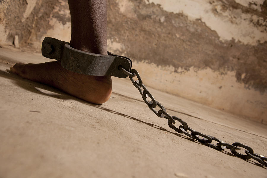 Chained At The Ankle Photograph by Joshlaverty