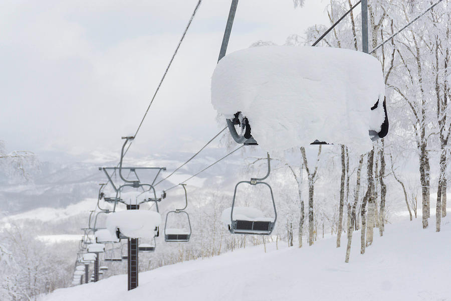 Chairlift Filled With Snow Photograph by Brandon Huttenlocher - Pixels