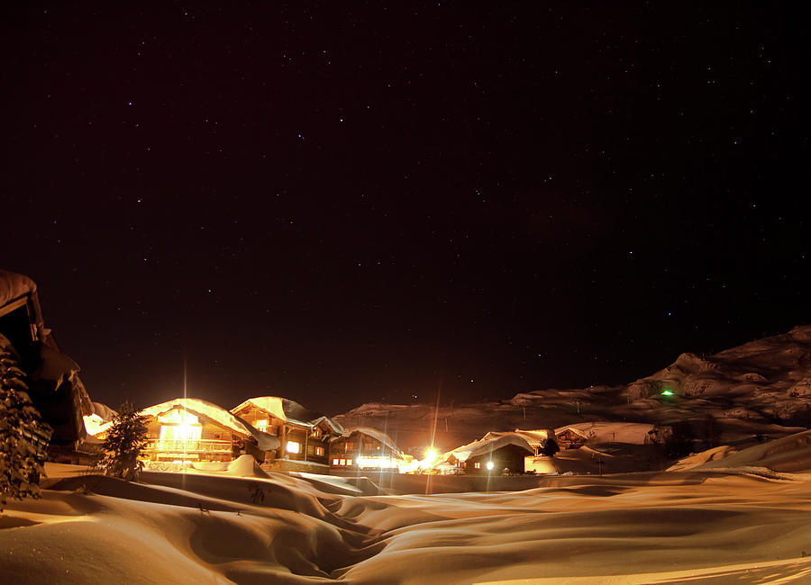 Chalets In Snowy Landscape In The Alps Photograph by Artur Debat