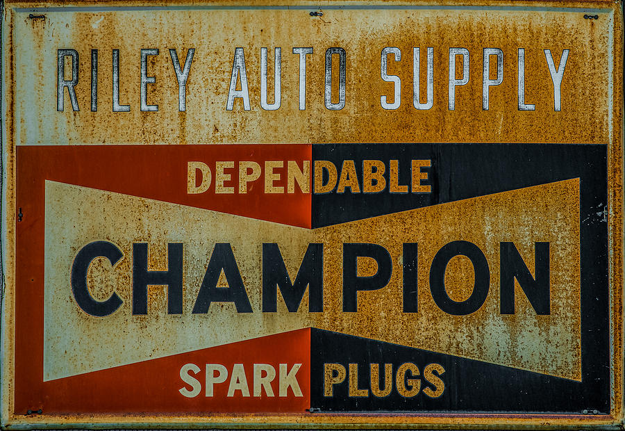 Champion Plug Sign Photograph by Paul Freidlund