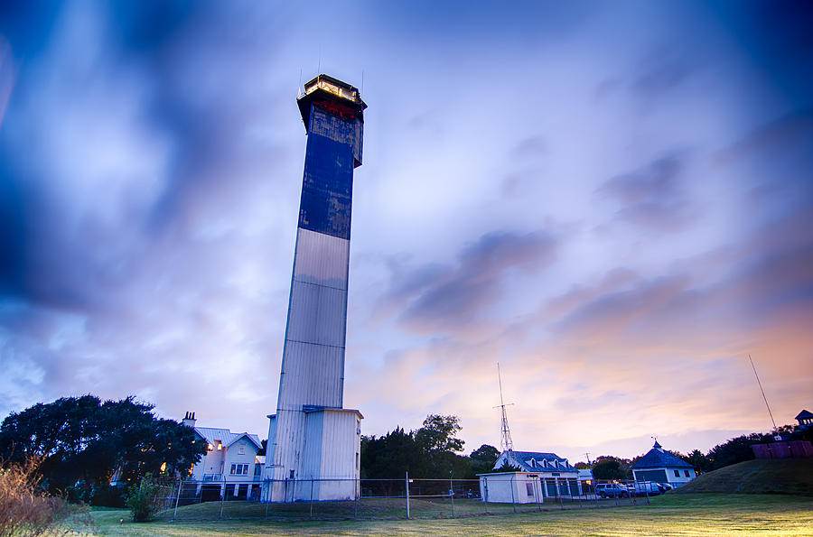 Charleston lighthouse at night  located on Sullivans Island in  Photograph by Alex Grichenko