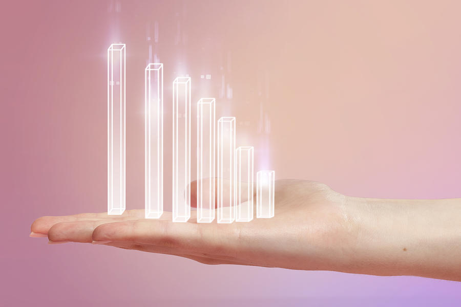 Chart resting on hand with pink studio background Photograph by Paper Boat Creative