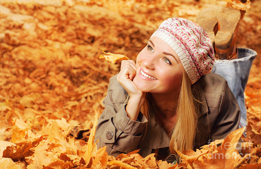 Cheerful teen on fall foliage Photograph by Anna Om
