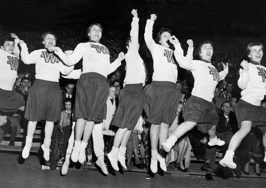 Basketball Photograph - Cheerleaders Jump For Joy by Underwood Archives