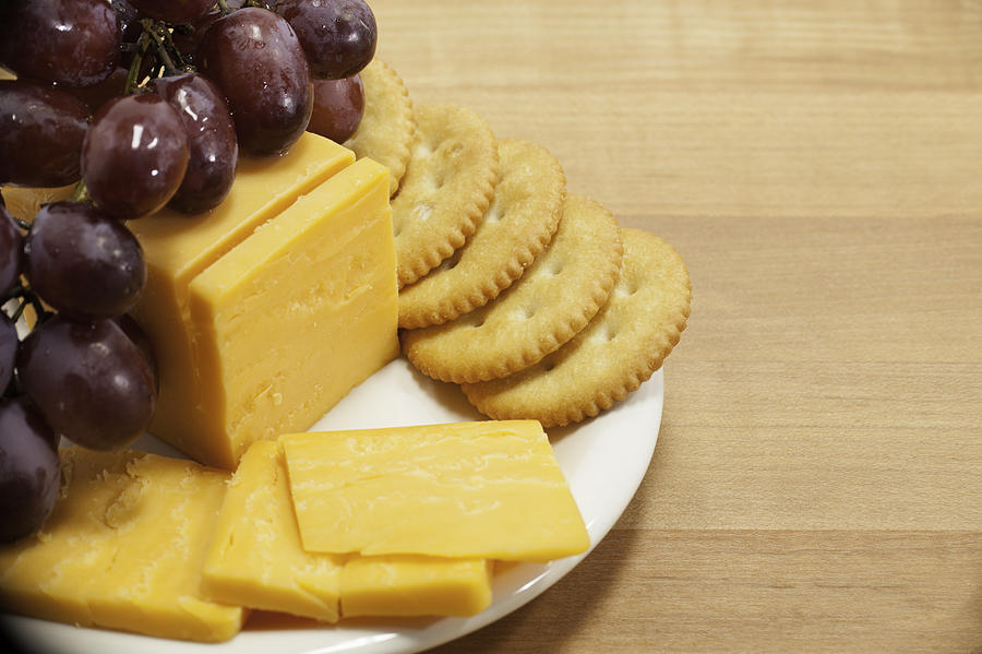 Cheese and Crackers with Grapes on Plate Photograph by Erin Cadigan ...