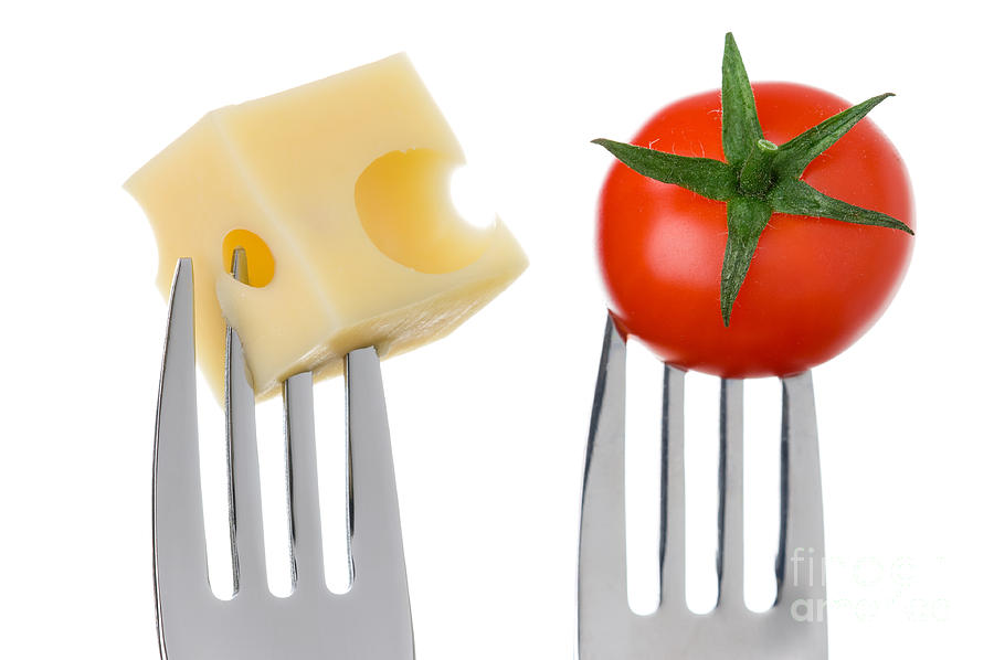 Cheese And Tomato On Forks Against White Photograph by Lee Avison